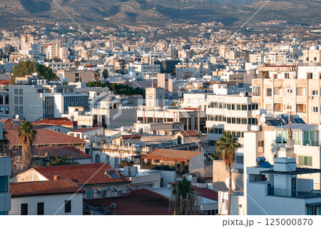 Cityscape of Limassol in Cyprus showing buildings and mountains in background 125000870