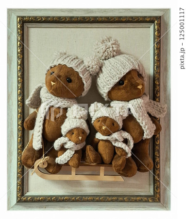 Bears on a sleigh in a frame. Creative interior design. Bears in knitted hats and scarves on a sleigh. 125001117