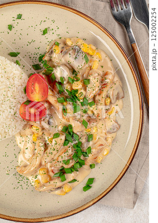 Portion of chicken fricassee with rice 125002254