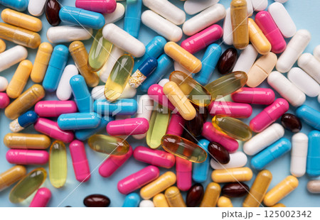 Different colorful pills for different symptoms. Health concept. Close-up. Different colorful pills for different symptoms. Health concept. Close-up. 125002342