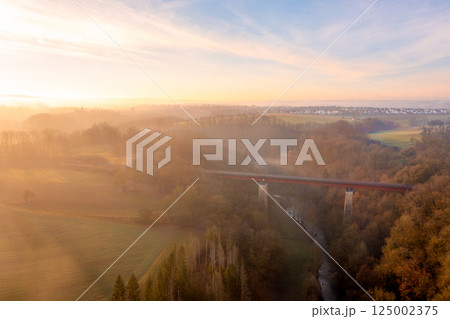 Sunrise aerial view with train bridge over river in the nature 125002375