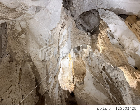 Brown grunge background. Mountain texturelight brown rock in a cave tourism nature Brown grunge background. Mountain texturelight brown rock in a cave tourism nature 125002429