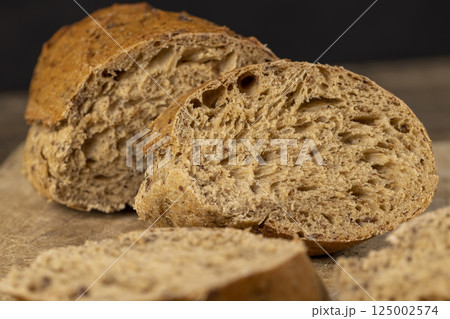 a healthy loaf of soft bread with added seeds and bran 125002574