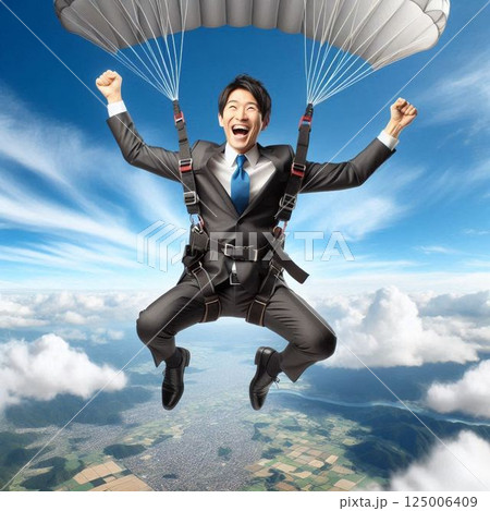パラグライダーをするサラリーマン パラグライダーをするサラリーマン 125006409