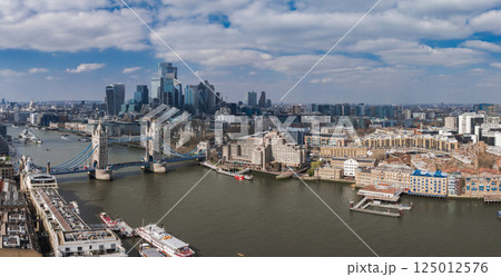 Aerial view of Tower Bridge over the River Thames with the City of London skyline, including the Walkie Talkie and Gherkin buildings in the background. Aerial view of Tower Bridge over the River Thames with the City of London skyline, including the Walkie Talkie and Gherkin buildings in the background. 125012576