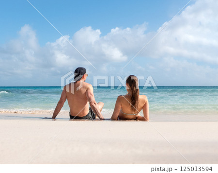 Handsome man cute woman and white sand beach Handsome man cute woman and white sand beach 125013594