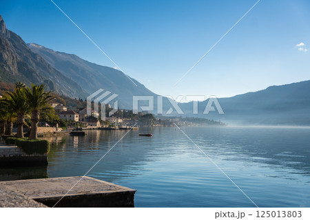 View of small village on coastline of Gulf of Kotor Bay next to Kotor town in Montenegro 125013803