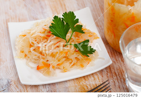 Homemade sauerkraut on white plate Homemade sauerkraut on white plate 125016479