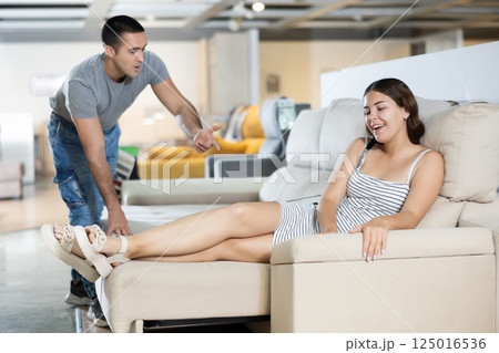 Family are choosing sofa together in furniture store Family are choosing sofa together in furniture store 125016536