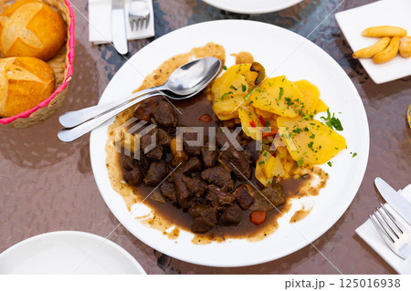 Venison ragout with port wine, thyme and mushroom aroma. Traditional dish of Toledo Venison ragout with port wine, thyme and mushroom aroma. Traditional dish of Toledo 125016938