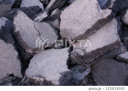 Damaged asphalt. Replacement of asphalt in the process of road repair work 125019385