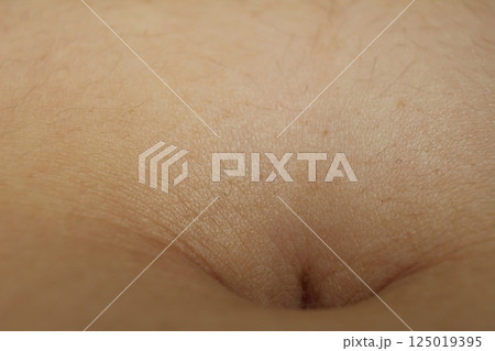 A close-up of the navel on the abdomen. Types of navels A close-up of the navel on the abdomen. Types of navels 125019395