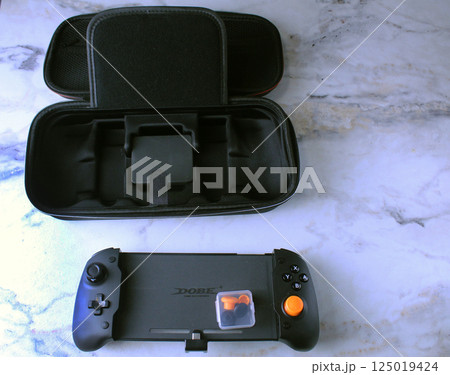 Mozyr, Belarus, March 16 2024: Nintendo Switch Game Console Controller with Black Case Top View 125019424