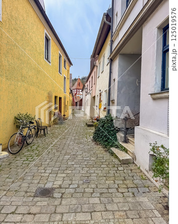 Charming cobblestone alleyway between colorful European village houses. High quality photo 125019576