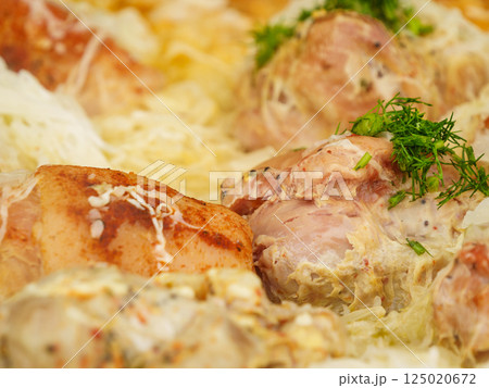 Many pork knuckle in big pot. 125020672