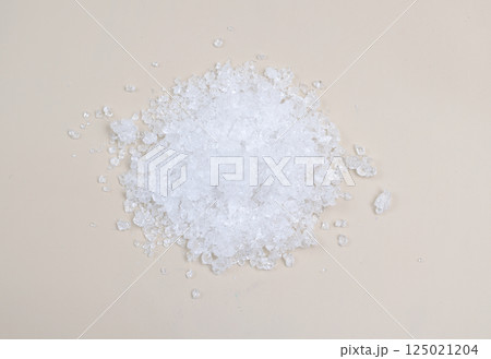 Cadmium nitrate powder on beige background Cadmium nitrate powder on beige background 125021204