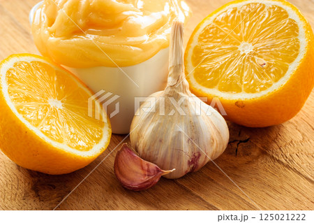 Honey garlic and lemon on wooden rustic table. Honey garlic and lemon on wooden rustic table. 125021222