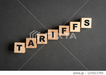 Tariffs, word on square wooden blocks. Tariffs, word on square wooden blocks. 125021793