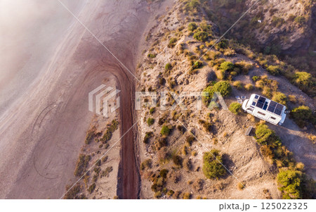 Caravan with solar panels on roof camp on coast, Spain. Aerial view. Caravan with solar panels on roof camp on coast, Spain. Aerial view. 125022325