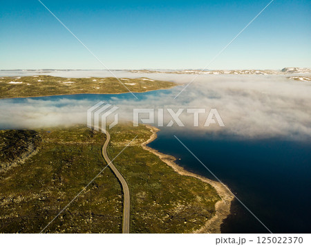 Road crossing Hardangervidda plateau, Norway. Aerial view. 125022370
