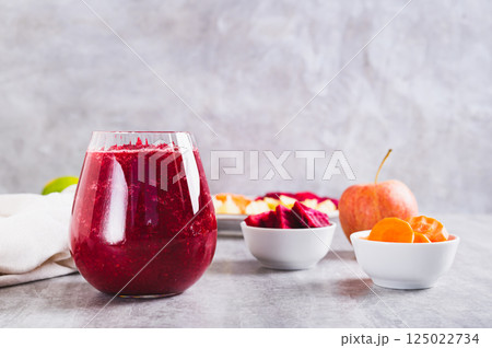 ABC juice from beetroot, carrot and apple for detox in a glass on the table ABC juice from beetroot, carrot and apple for detox in a glass on the table 125022734