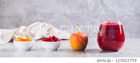 ABC juice from beetroot, carrot and apple for detox in a glass on the table web banner ABC juice from beetroot, carrot and apple for detox in a glass on the table web banner 125022759