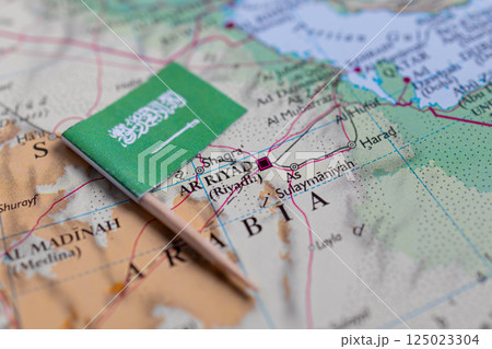 Flag of Saudi Arabia close-up on the map. Capital Riyadh. Close-up of the world map. Saudi Arabia Flag of Saudi Arabia close-up on the map. Capital Riyadh. Close-up of the world map. Saudi Arabia 125023304