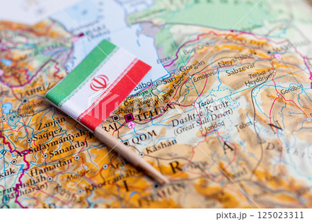 A close-up of the flag of Iran on the map. Capital Tehran. Close-up of the world map. Iran A close-up of the flag of Iran on the map. Capital Tehran. Close-up of the world map. Iran 125023311