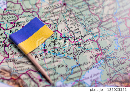 Flag of Ukraine close-up on the map. The capital Kiev. A close-up of the world map. Ukraine 125023321