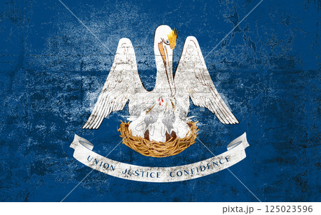 Louisiana State Flag. Dirty Louisiana state flag on the wall. 125023596