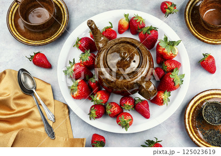 Strawberry tea with fresh strawberries. Strawberry tea with fresh strawberries. 125023619