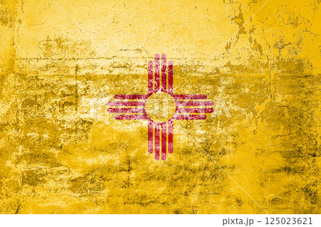 New Mexico State Flag. Dirty New Mexico state flag on the wall. New Mexico State Flag. Dirty New Mexico state flag on the wall. 125023621