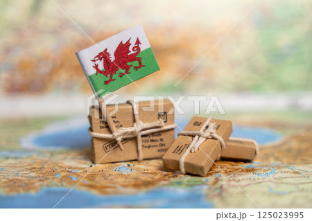 Global Shipping and Delivery Services to Wales: Small Business Parcels on Vintage Map with Welsh Dragon Flag Global Shipping and Delivery Services to Wales: Small Business Parcels on Vintage Map with Welsh Dragon Flag 125023995