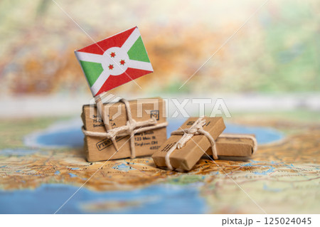 International Shipping and Delivery Services to Burundi: Small Packages with Flag on World Map Background, Export Logistics Concept 125024045