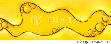Flowing yellow oil liquid texture with bubbles 125024261