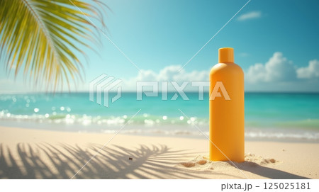 Yellow sunscreen mockup bottle on sandy beach with palm leaf shadow and turquoise sea on background, summer vacation concept, copy space 125025181