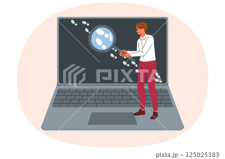 Man is looking for traces on internet, working OSINT specialist and holding loupe near laptop 125025383