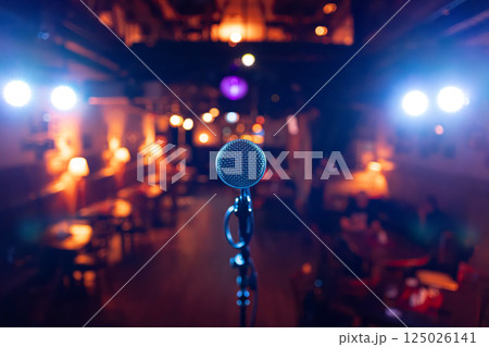 Microphone on stage against a background of auditorium. 125026141