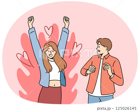 Excited woman is in love with man who is scared because of excessive passion from fan Excited woman is in love with man who is scared because of excessive passion from fan 125026145