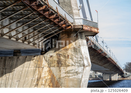 Rusty Bridge Pillar and Weathered Steel Supports under a Suspension Bridge Rusty Bridge Pillar and Weathered Steel Supports under a Suspension Bridge 125026409