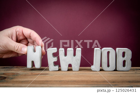 NEW JOB Word Created from Concrete Alphabet Letters on Wooden Desk NEW JOB Word Created from Concrete Alphabet Letters on Wooden Desk 125026431