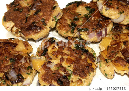 Close up of fried fish cakes or vegetable patties fritters juicy and tasty 125027518