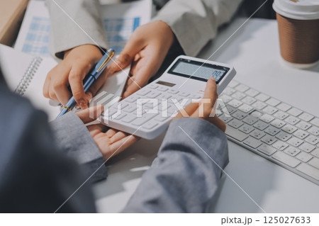 Portrait of Asian young female working on laptop at office Portrait of Asian young female working on laptop at office 125027633