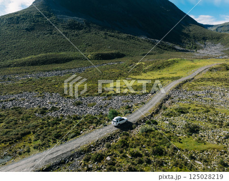 Driving off road car on high altitude mountains Driving off road car on high altitude mountains 125028219