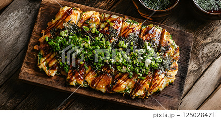 Okonomiyaki Japanese savory pancake with toppings 125028471