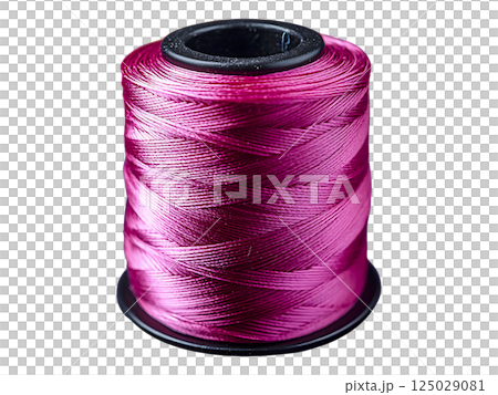 Closeup of a vibrant pink thread spool, surrounded by a blurred background of colorful thread spools.  A concept image representing creativity, craft, and textile artistry. 125029081
