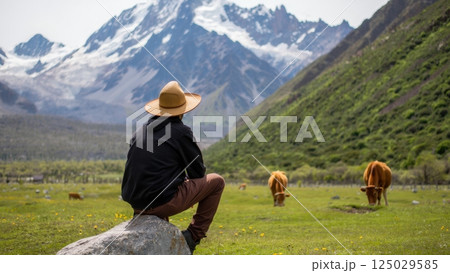 hikers in the mountains enjoying the majestic view hikers in the mountains enjoying the majestic view 125029585
