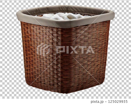 Stylish brown wicker laundry basket with a beige fabric liner, filled with soft white towels. Perfect for bathroom organization, home decor, and lifestyle imagery. 125029935