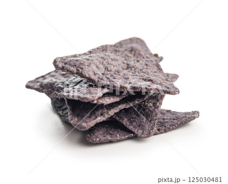 Dark nachos chips isolated on white background. 125030481