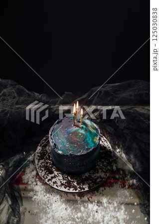 Beautiful Birthday Cake with Candles on a Black Background 125030838